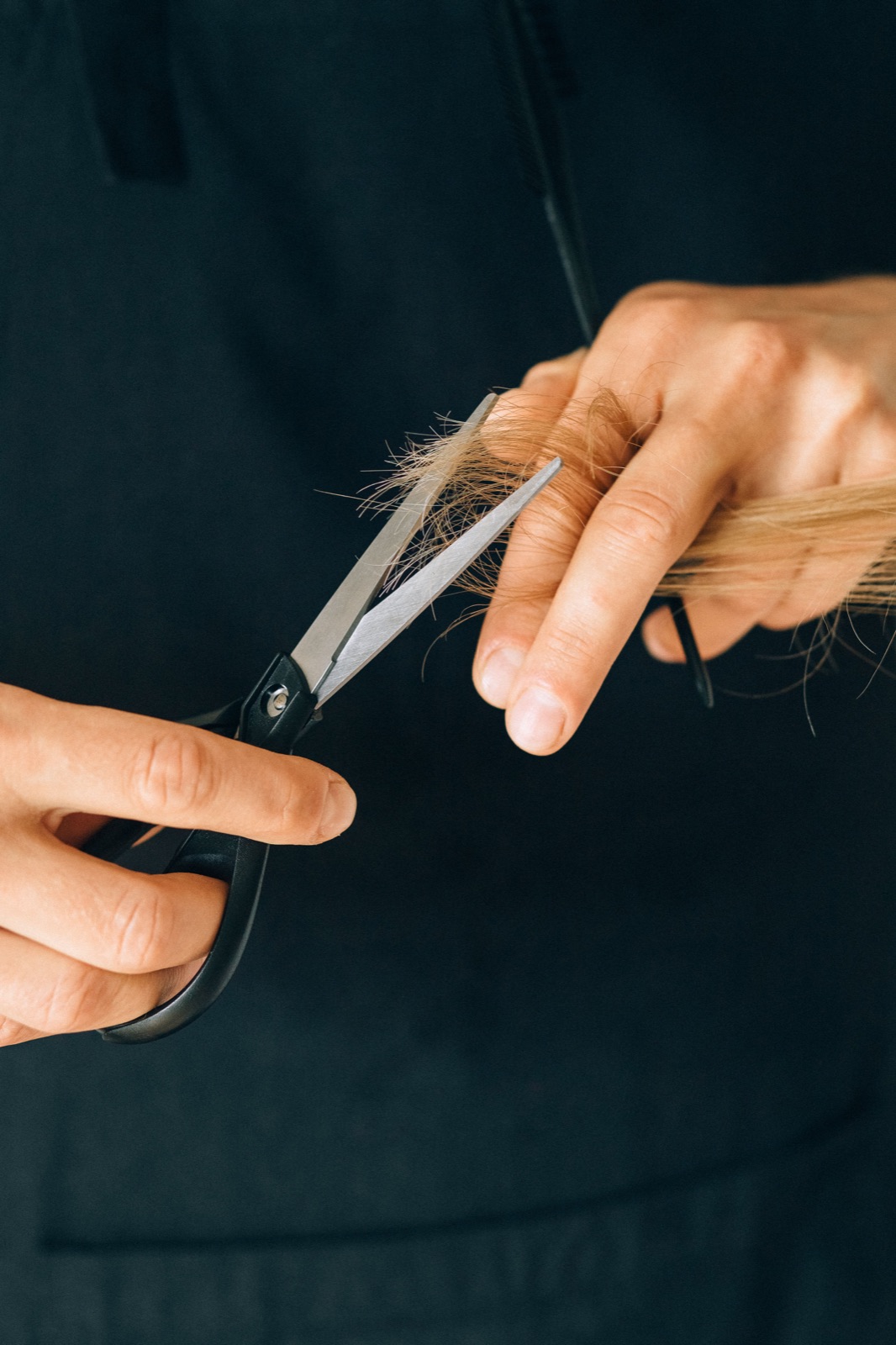 A hairdresser cutting a client’s hair